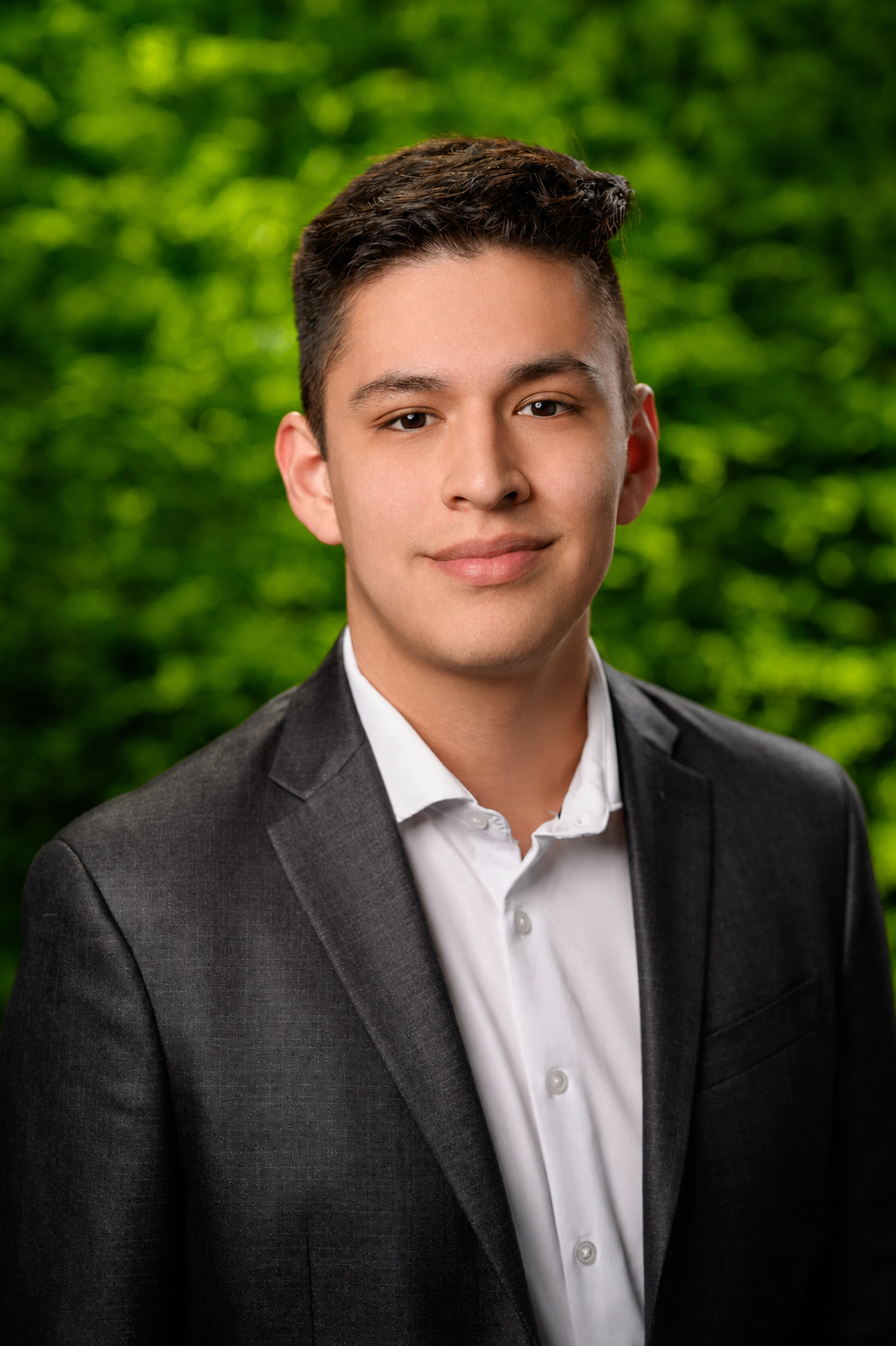 Professional portrait of Francisco Moreno wearing a dark blazer and white shirt.
