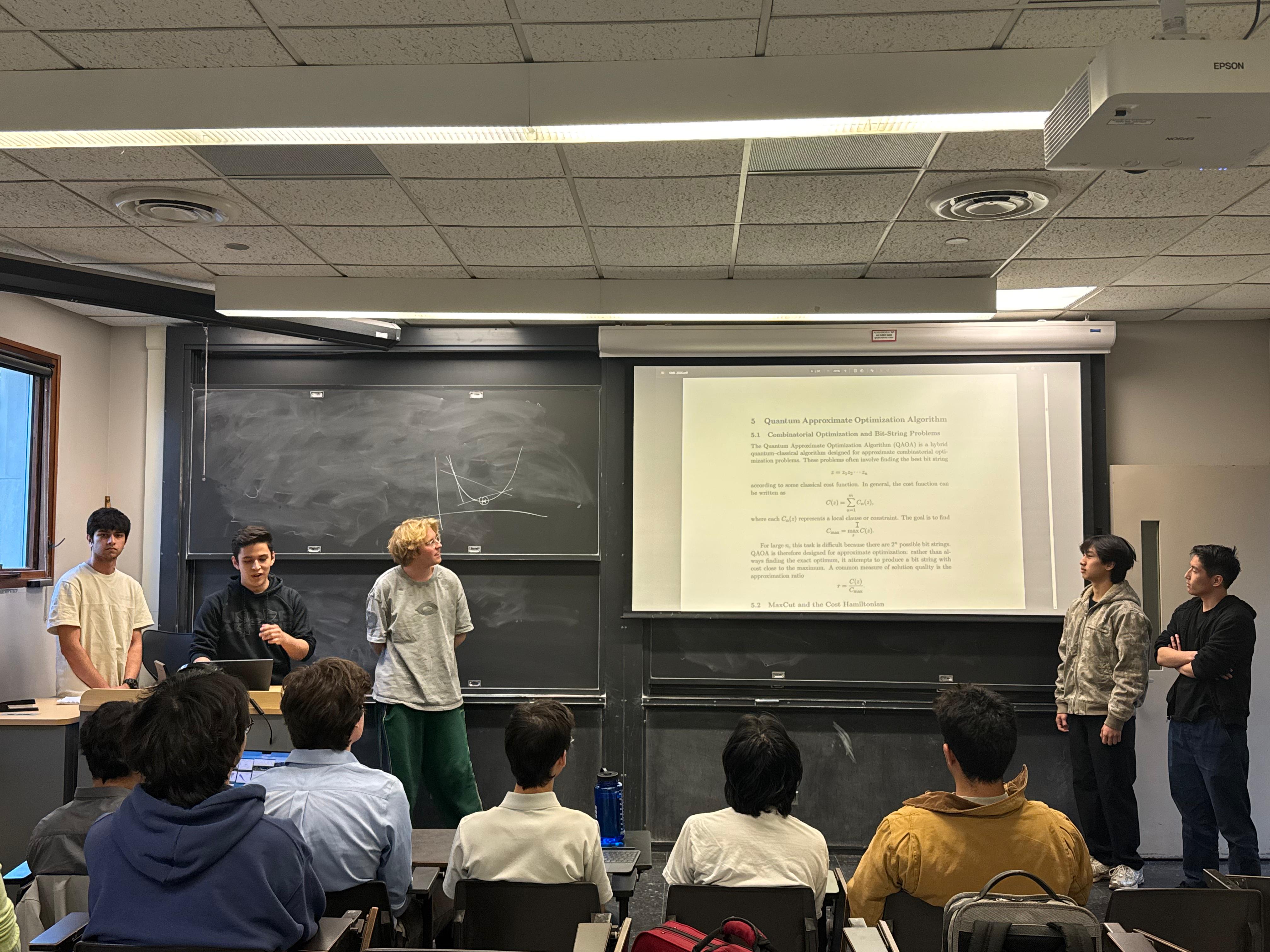 Francisco Moreno and collaborators presenting a quantum machine learning project in a classroom.